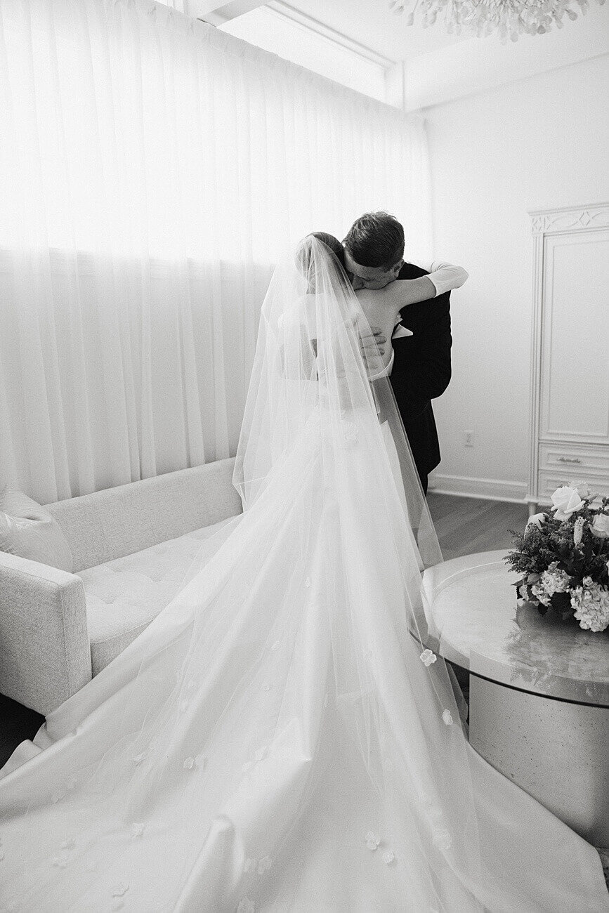 brides and dad hugging for their first look