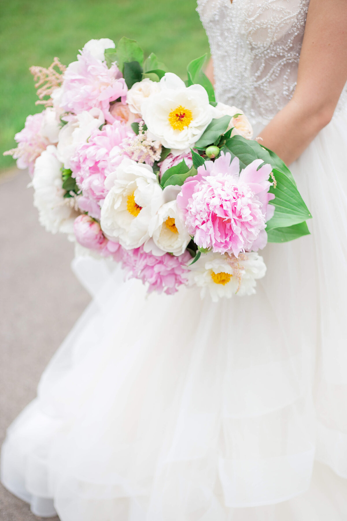 Top-Bride-holding-bouquet-of-bright-spring-colors-shot-by-Bethany-Lane-Photography