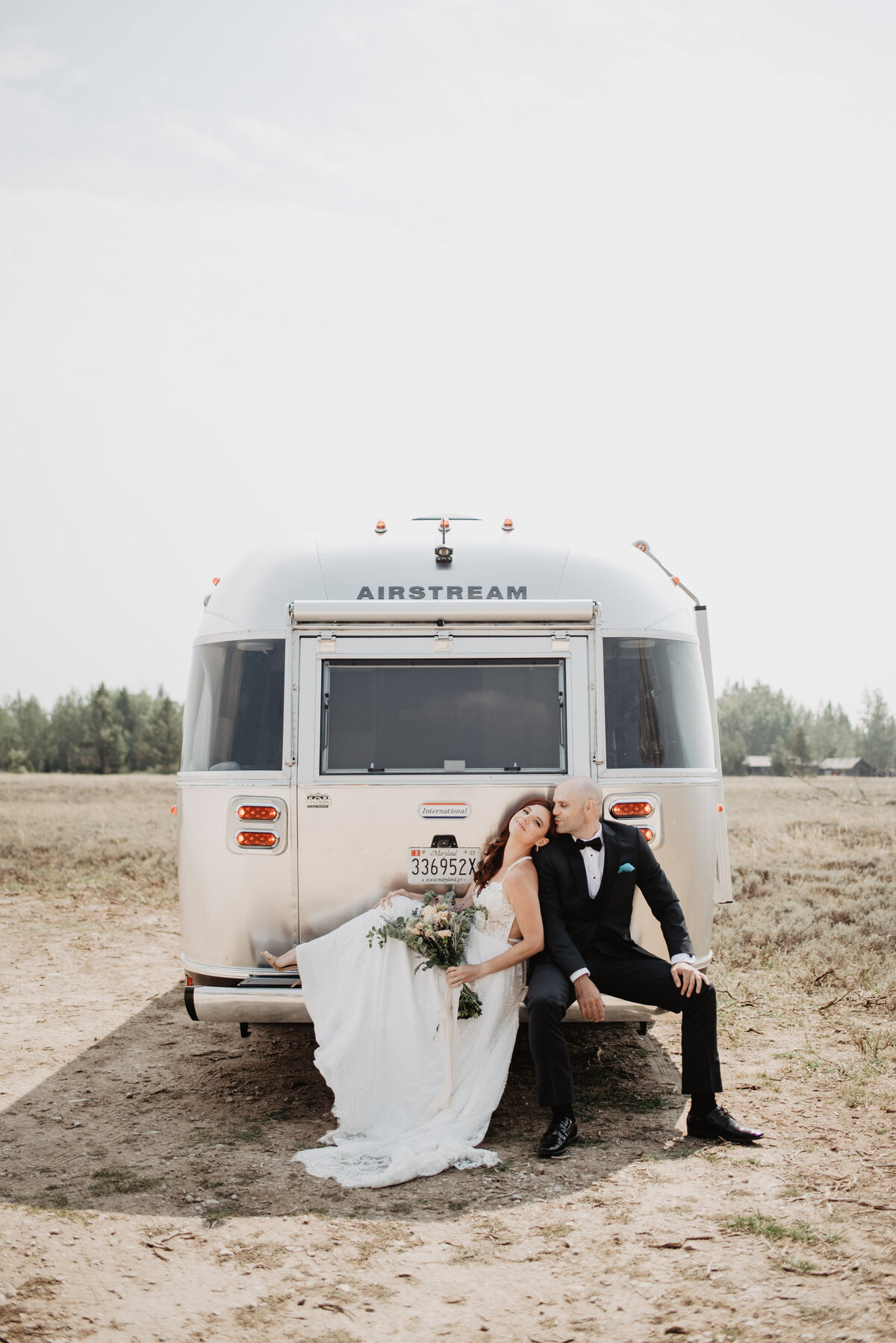 Jackson Hole photographers capture bride leaning against groom