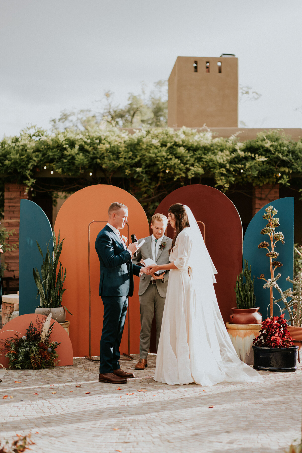 Bride and groom read their vows during their wedding ceremony on their wedding day.