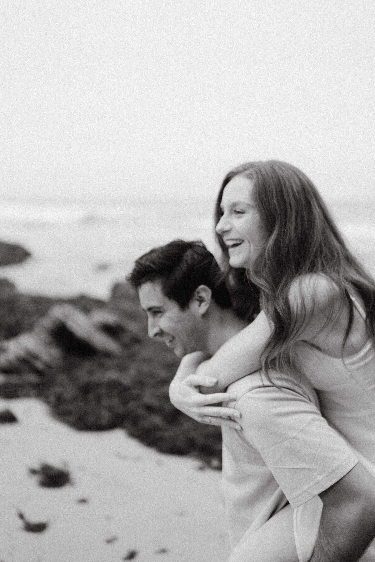couple shoot for maternity session during golden hour Oregon coast beach wedding/elopement - photographed by The Storytellers