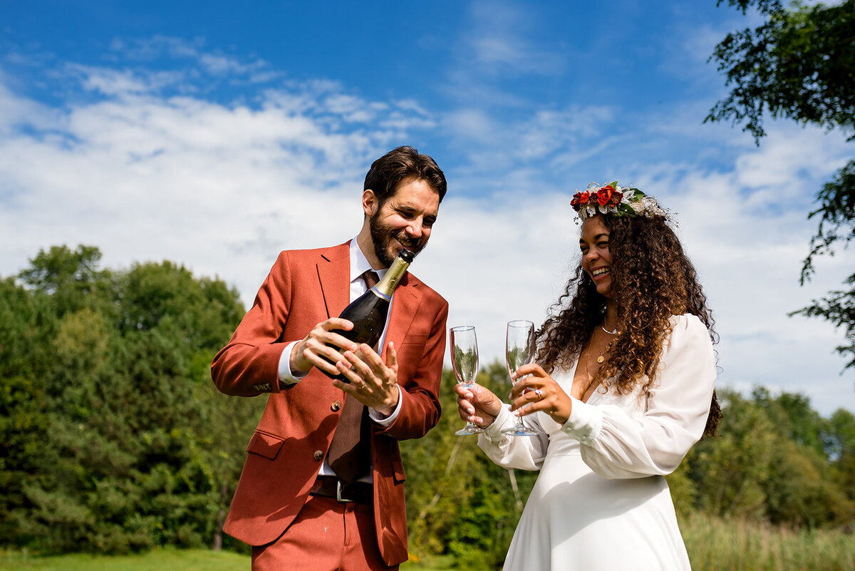 Celebrating their wedding with champagne toast