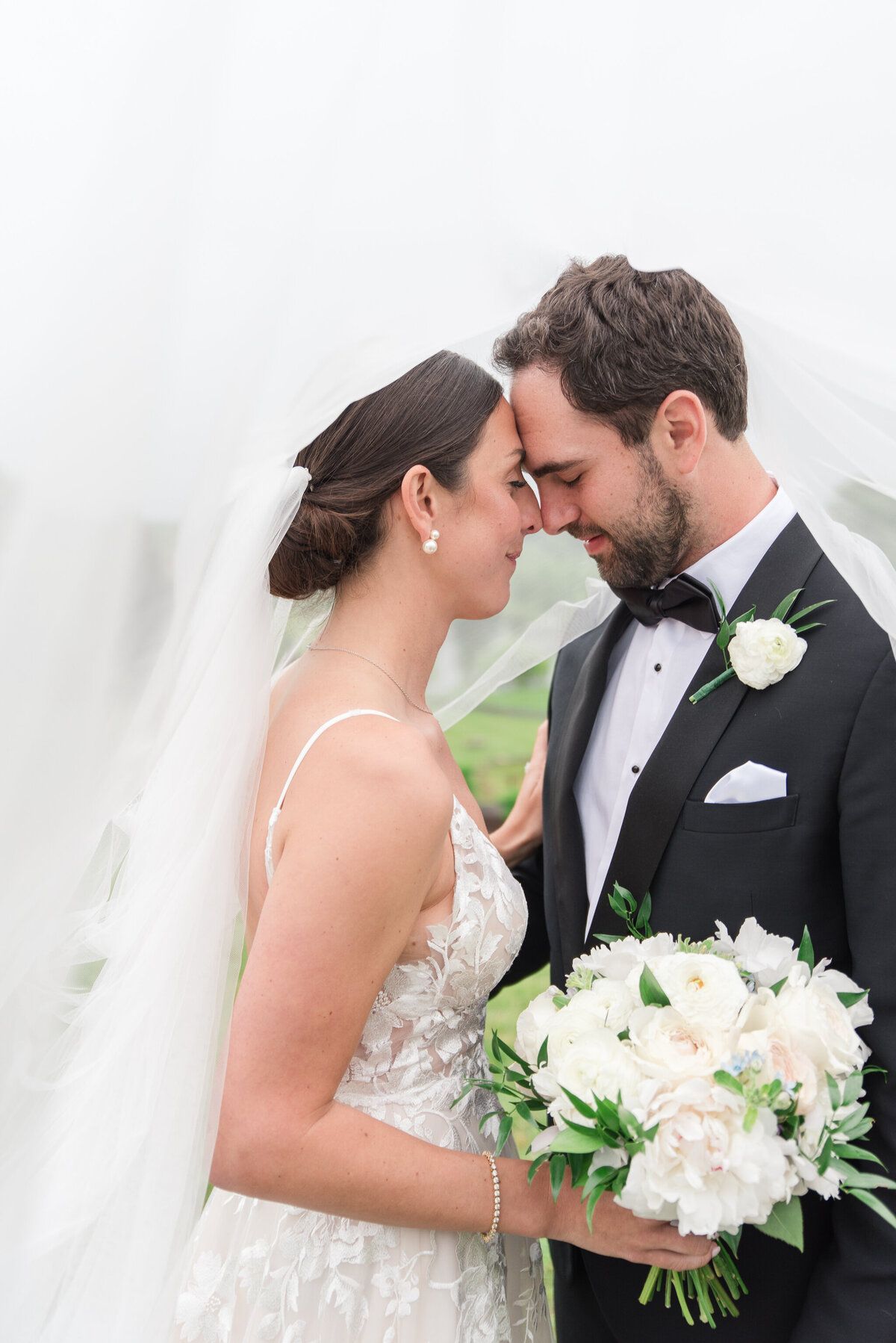 stone tower couple under the veil on wedding day