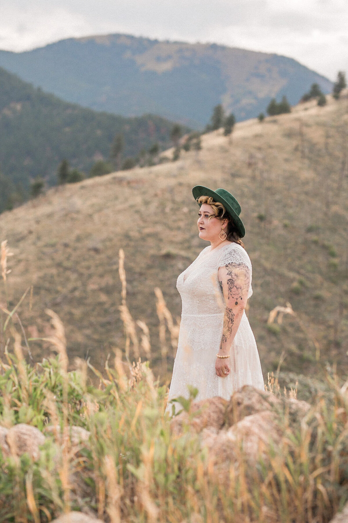 A bride enjoys the mountain view moments before her Colorado elopement