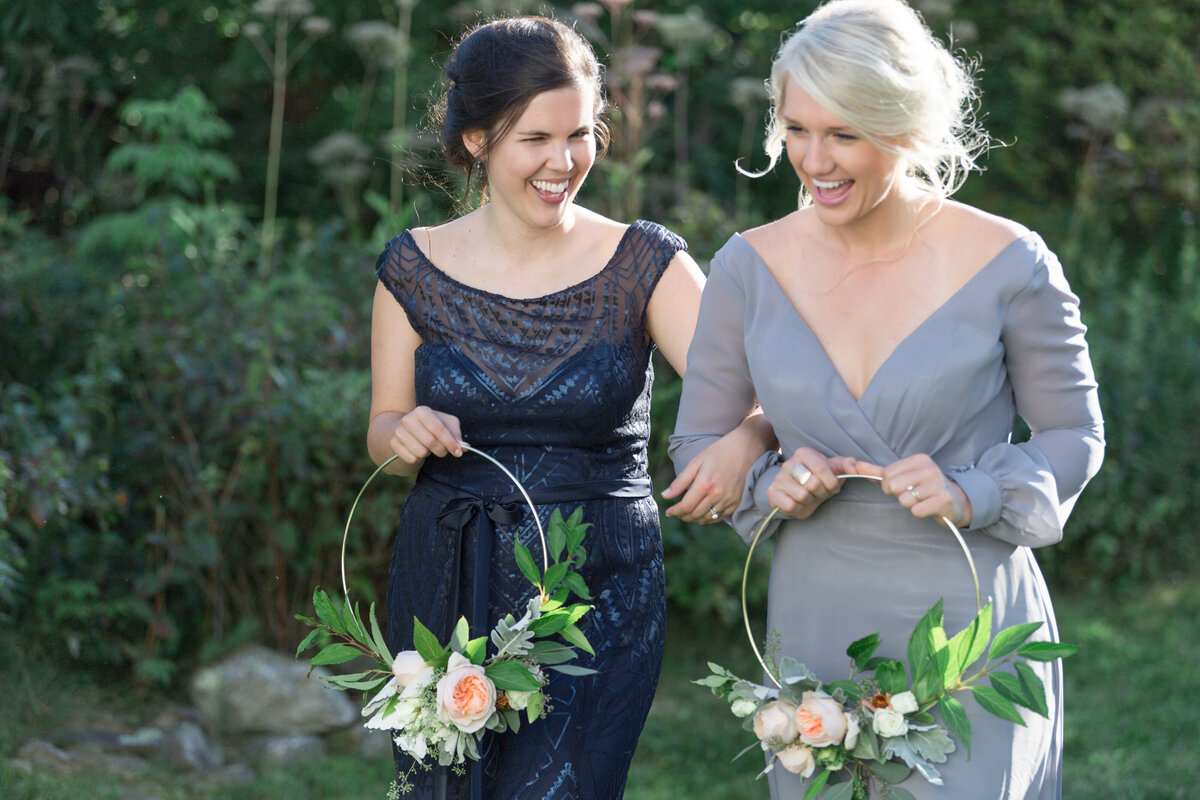 castine-bridesmaids-laughing-outside-wedding
