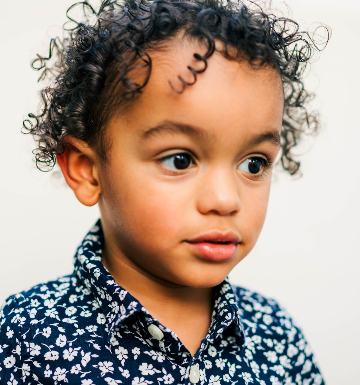 A fine art portrait of a child captured in studio style