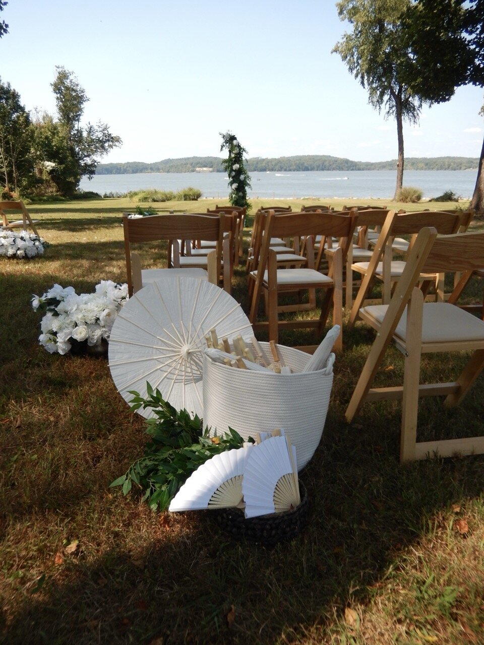 Scenic view from behind empty wedding ceremony chairs 