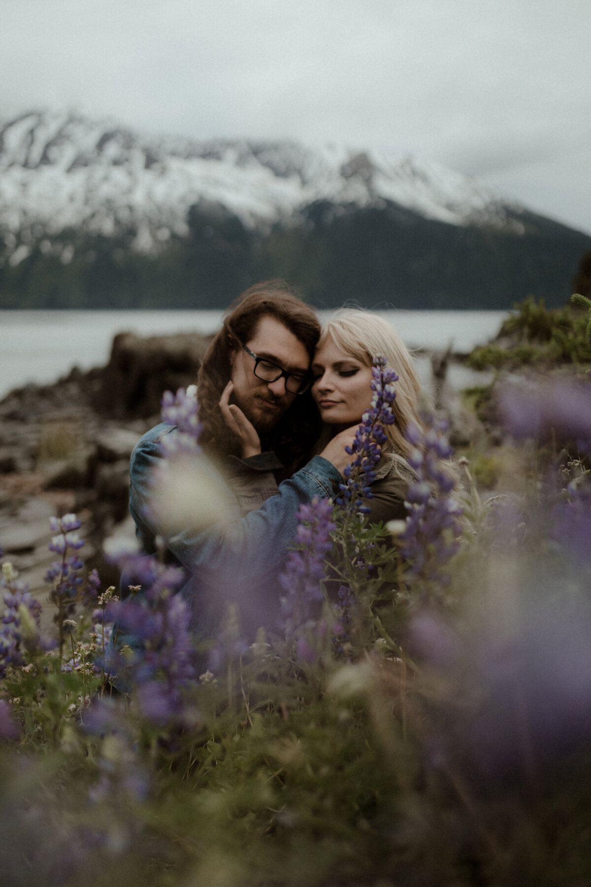 couple holding each other in lupine