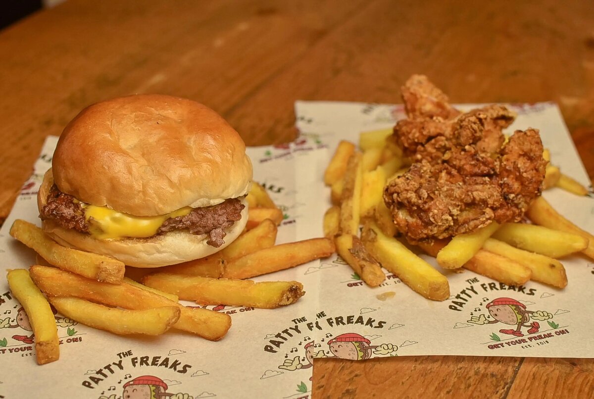 A burger and fries and Fried chicken and fries childs portion.