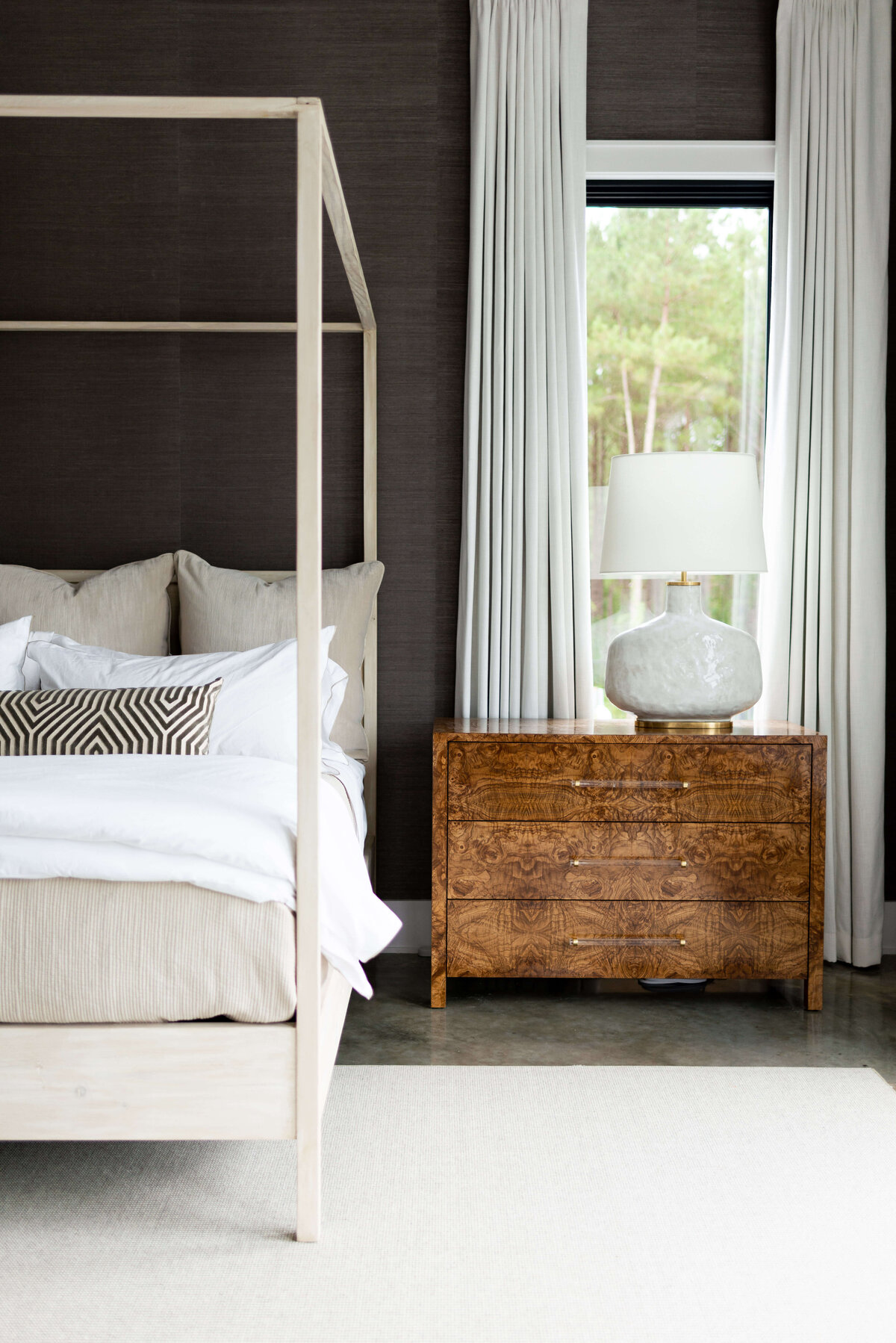 oyster creek studios building belt new build tan canopy bed and wooden side table in bedroom