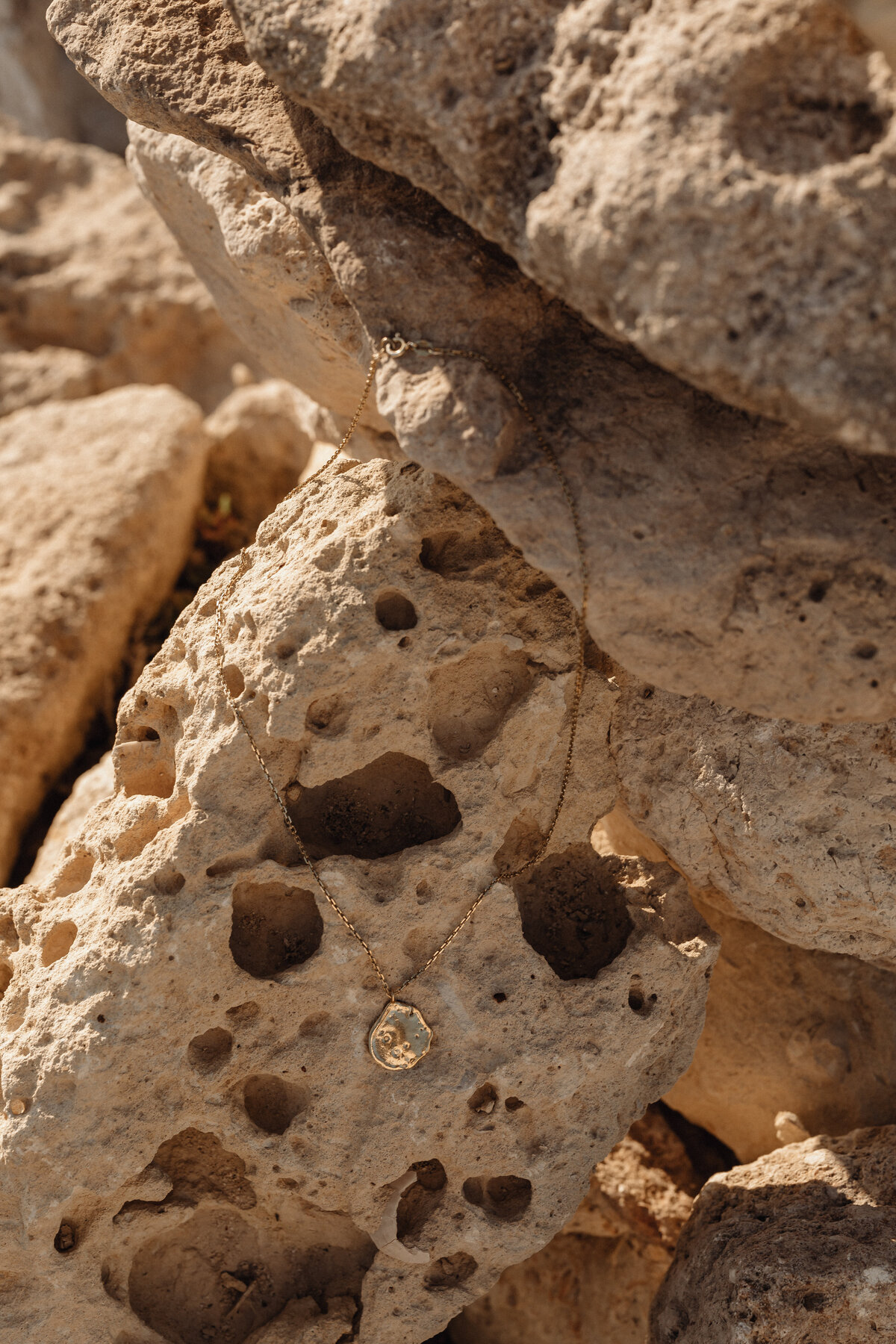 kaboompics_simplicity-by-the-sea-minimalist-jewelry-on-maltas-rocky-beach-31115
