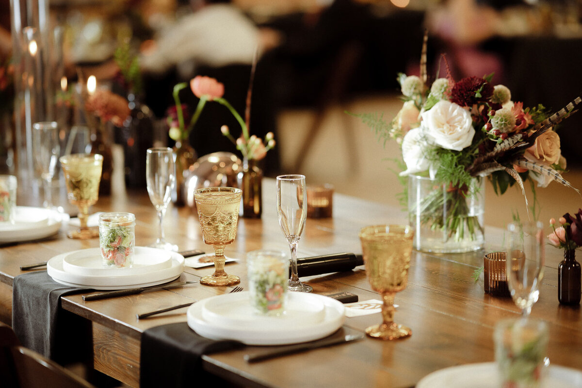 Amber cups with black napkins at a wedding reception.
