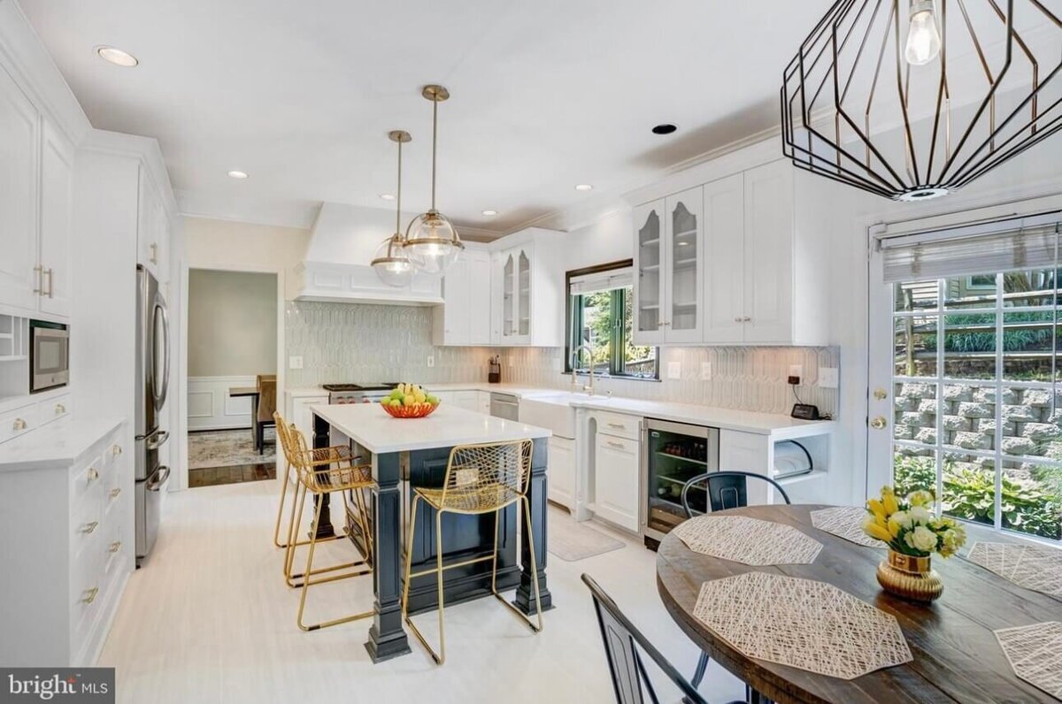modern-white-kitchen-island-gold-accents-breakfast-area.jpg
