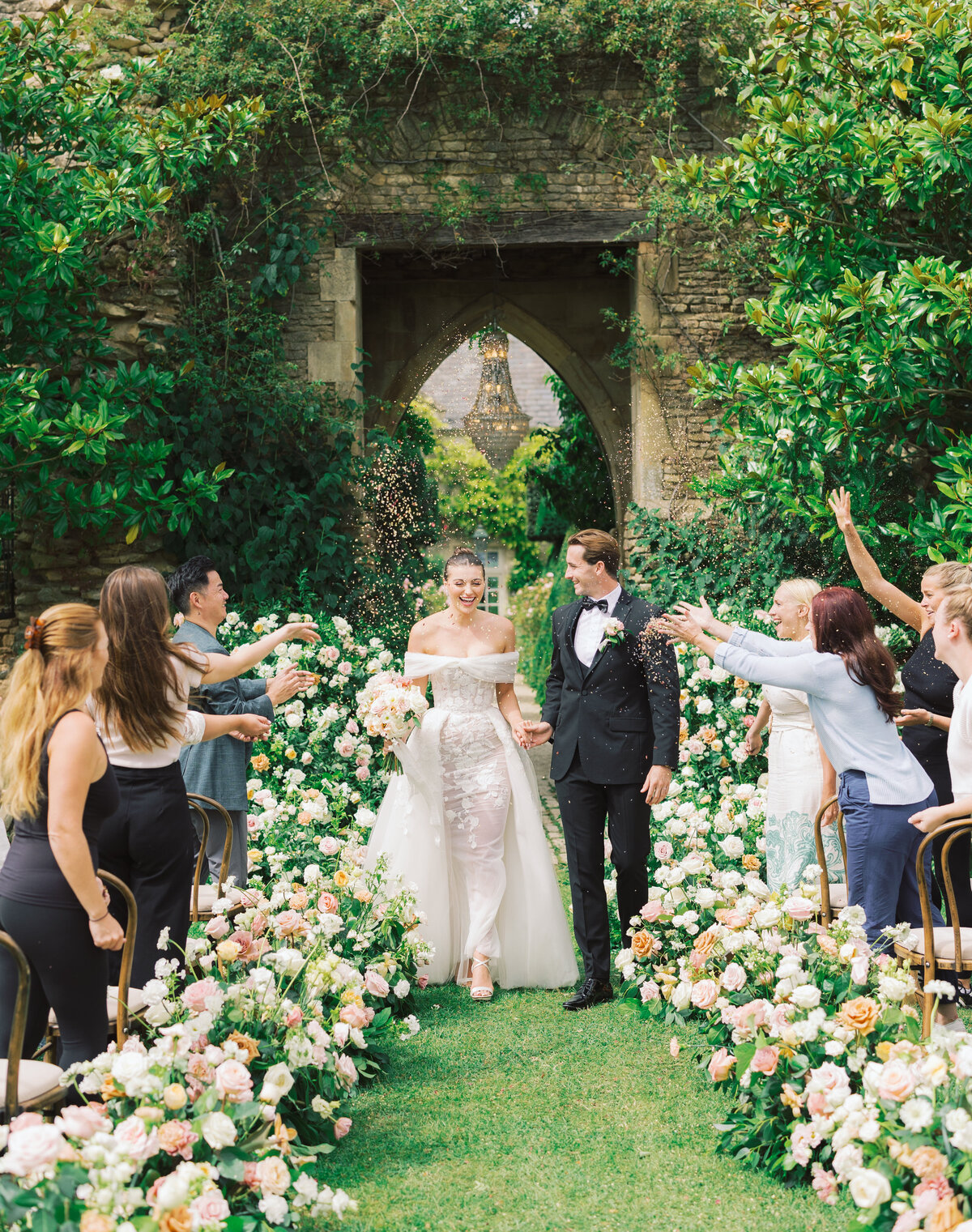 bride and groom walk down aisle