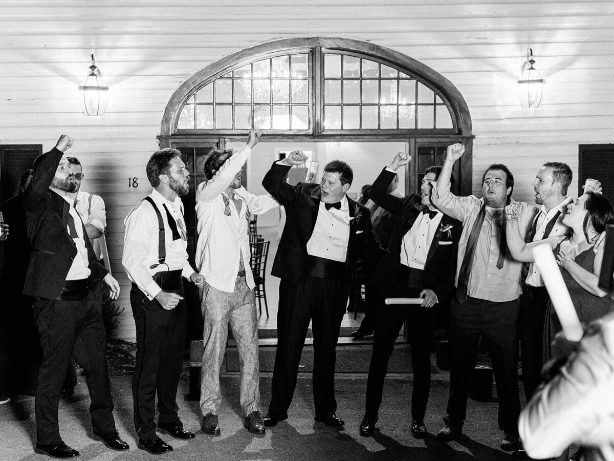 groom celebrating with his groomsmen