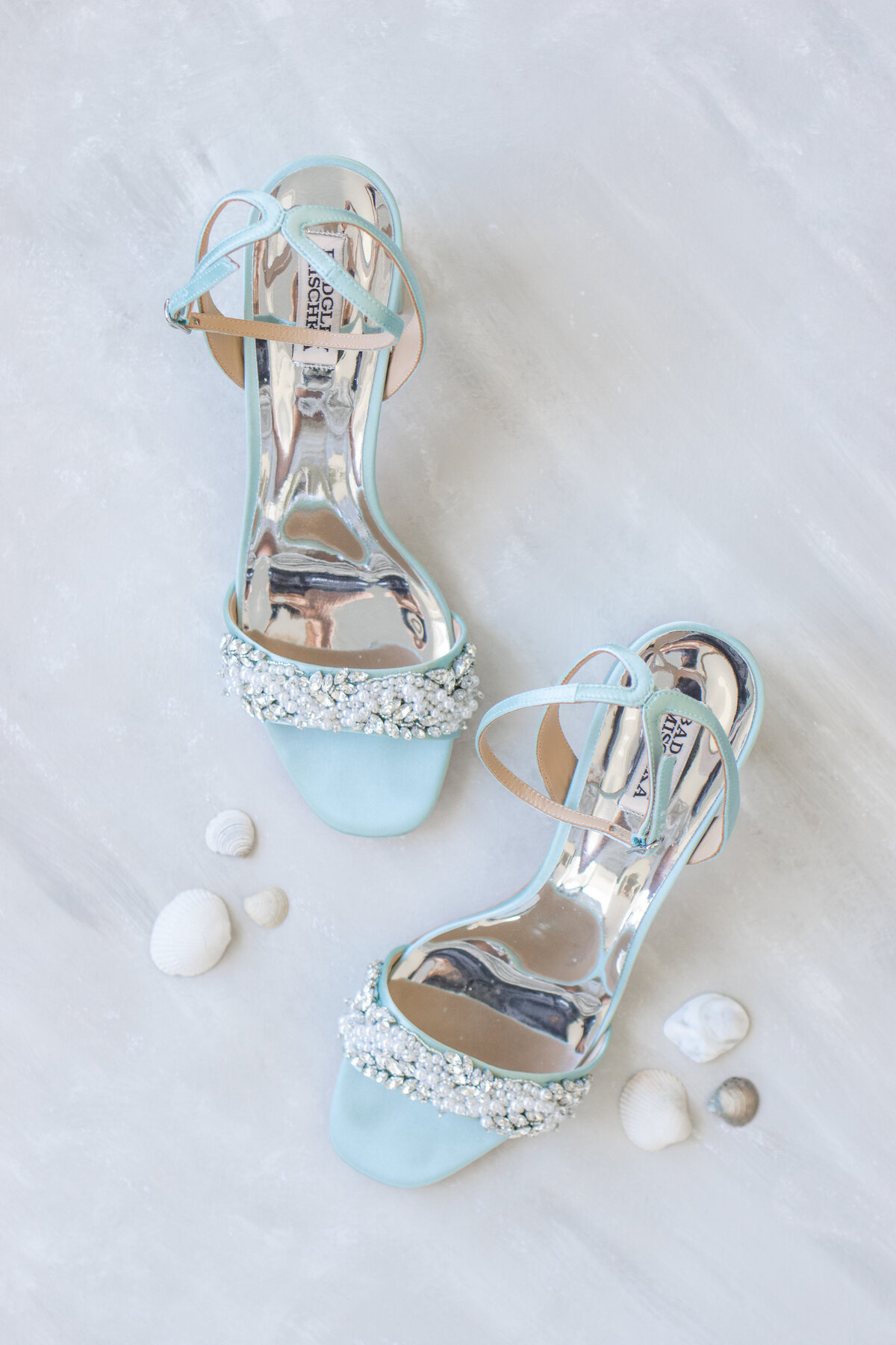 Blue badgley mischka wedding heels with silver sparkles on flatlay