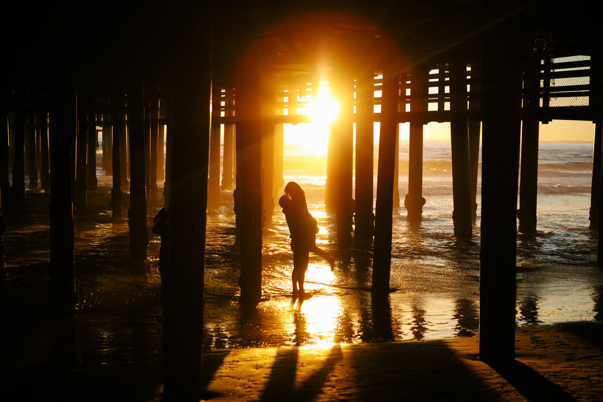 man and woman under pier