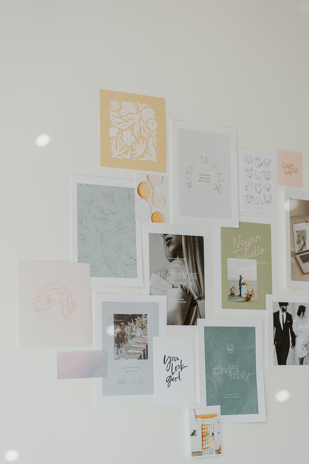 Styled mood board featuring prints and artwork during a Wildher and Co branding session in a downtown Kalamazoo studio.