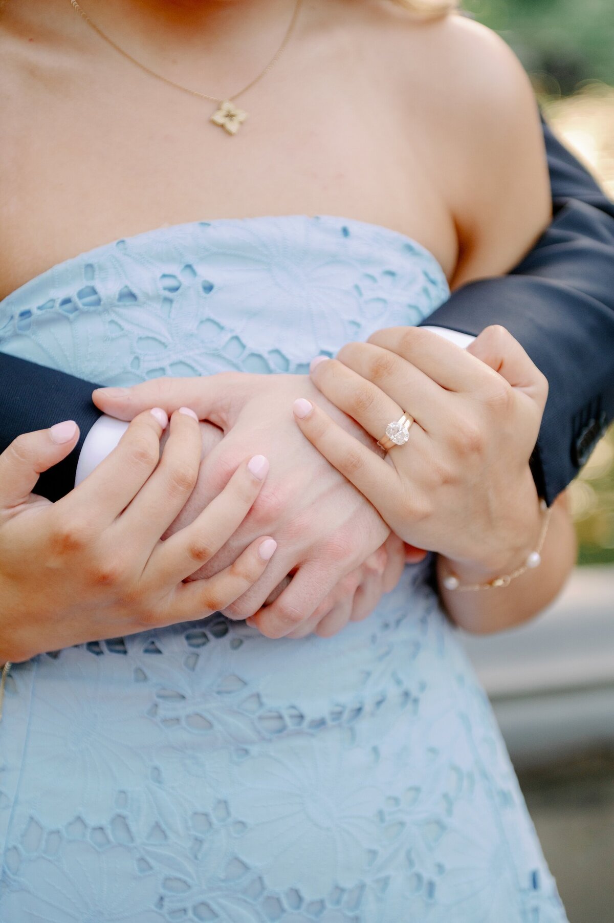 a couple standing with their hands entertwined