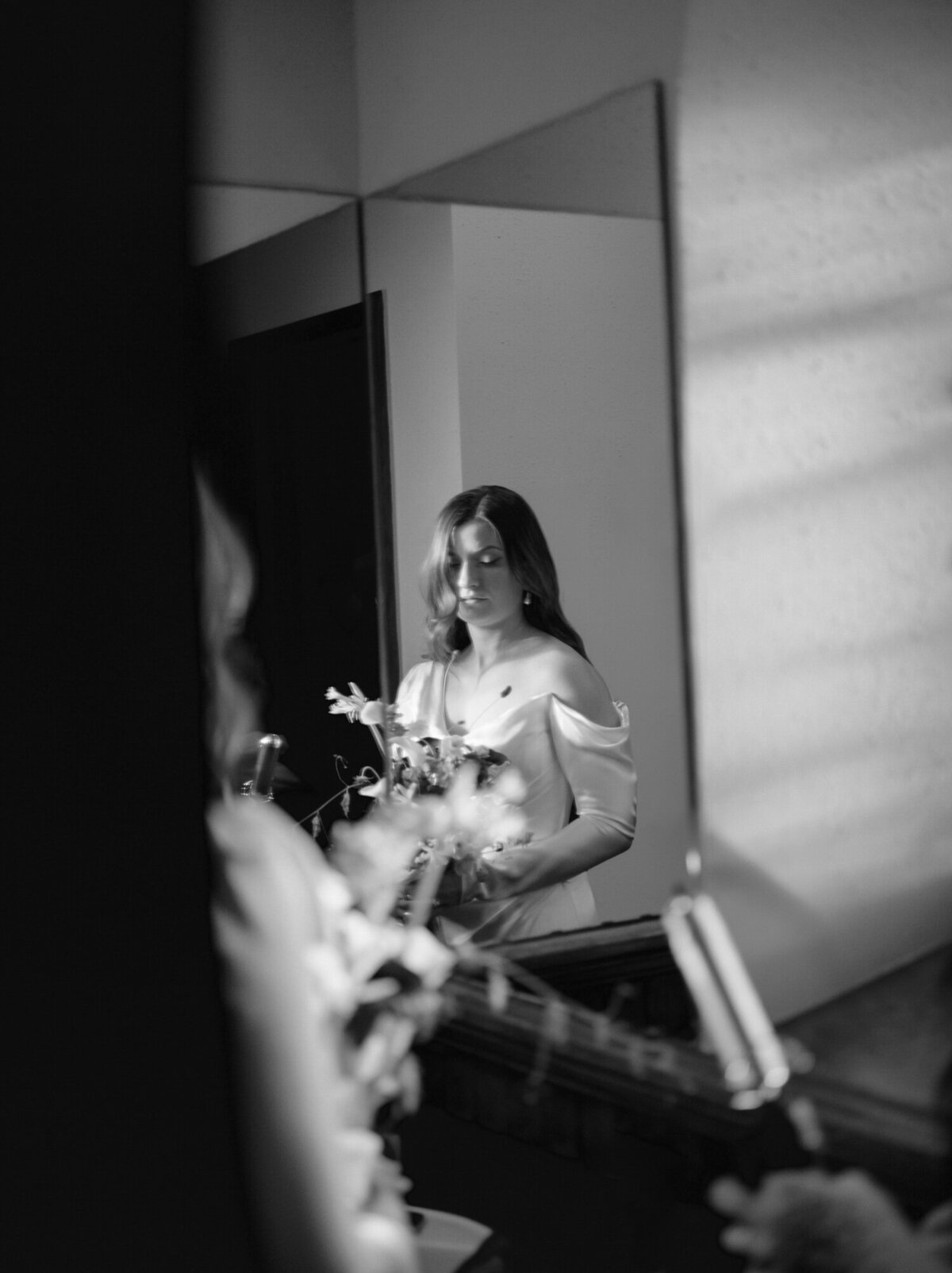 Candid wedding photographer Christina Harrison captures a bride in mirror in Detroit, Michigan
