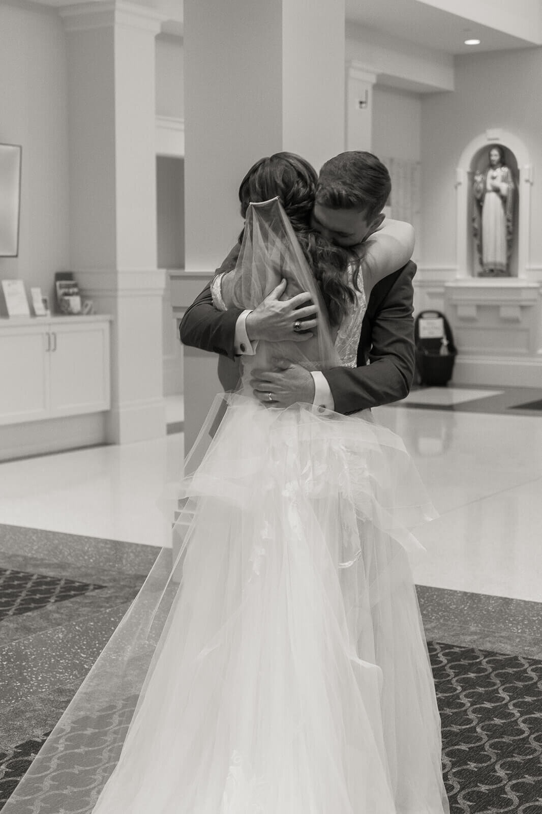 bride and groom sharing a hug after their wedding