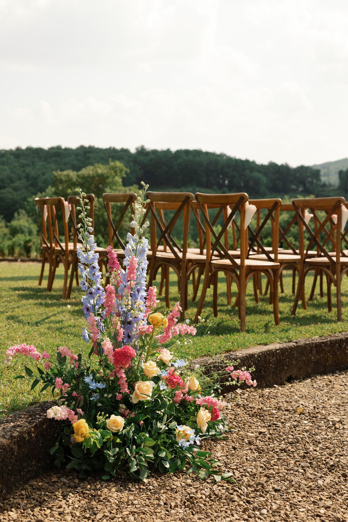 Beautiful ceremony decor and floral setup in the Tuscan villa garden