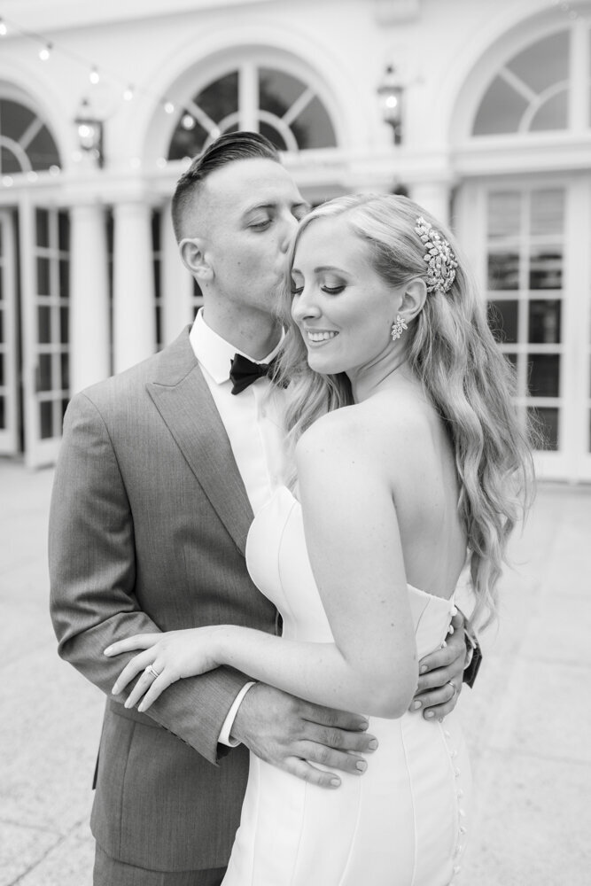 groom kisses bride's cheek - Wadsworth Mansion wedding photographer Rachel Girouard