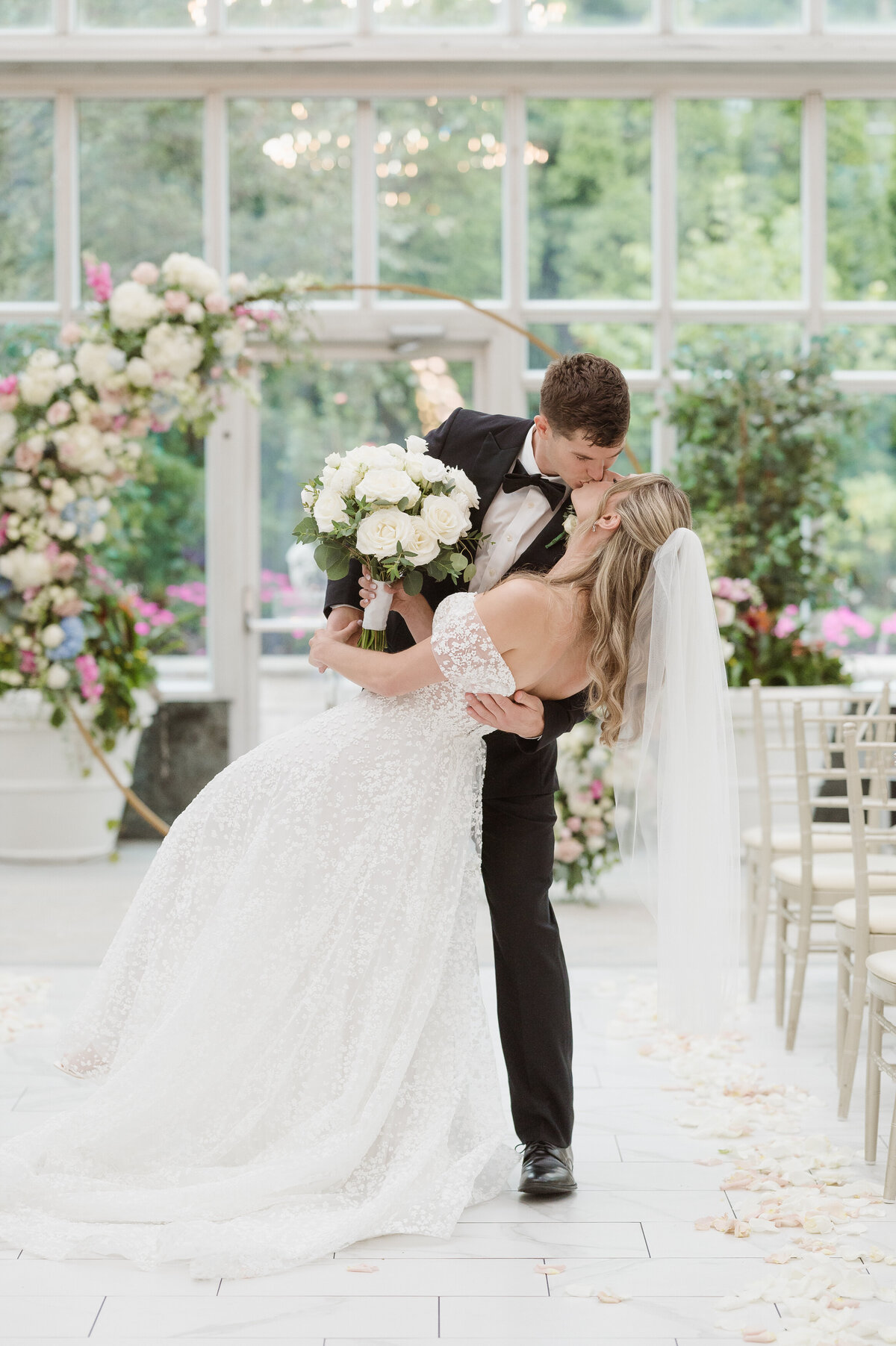 bride and groom portraits in the madison hotel conservatory venue nj