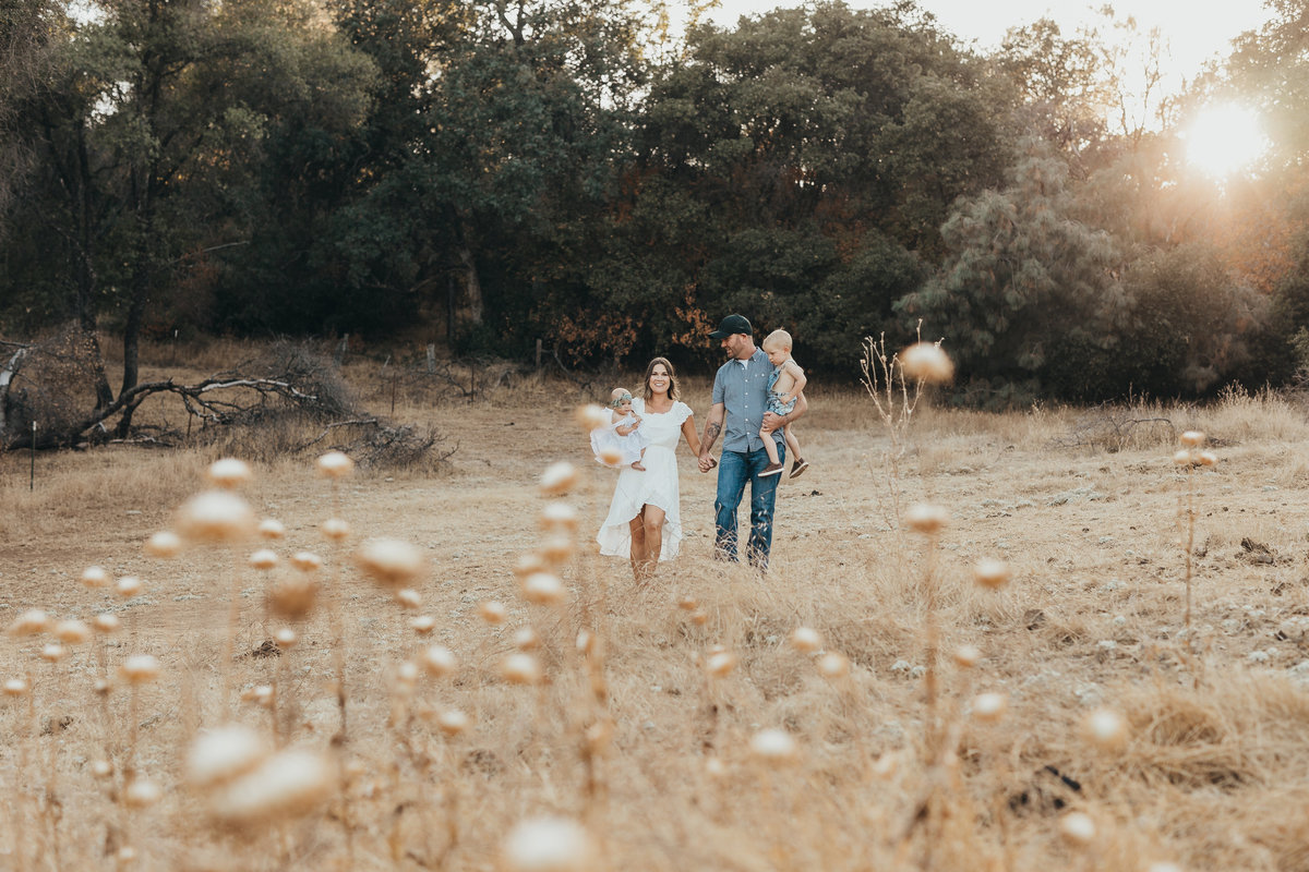 This image was taken up in Sonora California by Jolee Henley Photography who specializes in family photography, maternity photography and wedding photography. Jolee is based out of Patterson Ca. and travels all over. This image is of a family out in the rolling hills of Sonora.