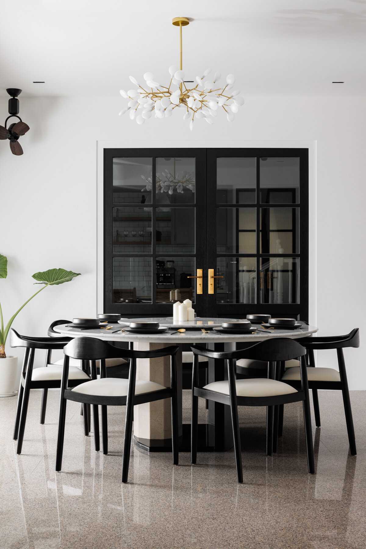 circular dining  table with doors in background