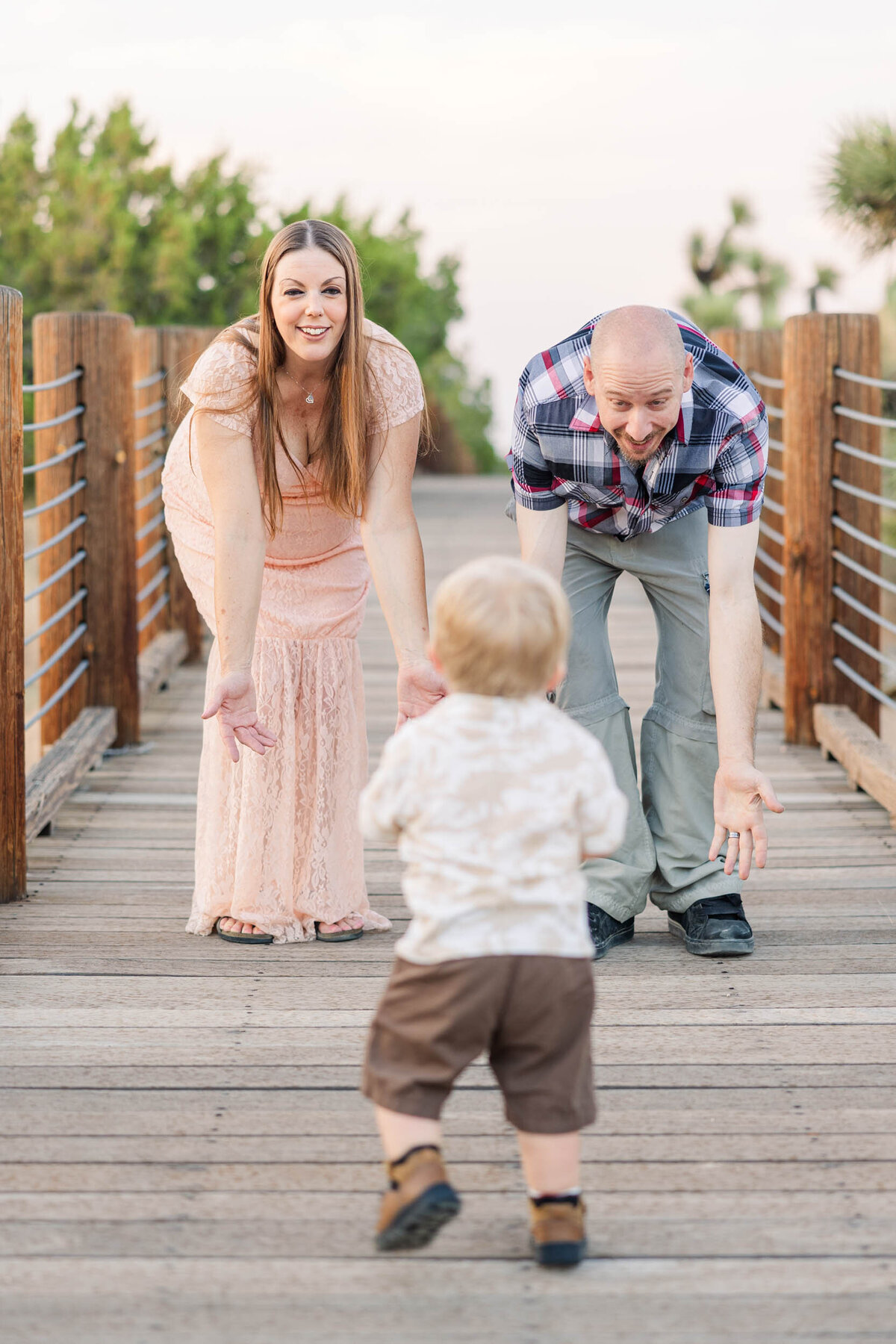 boy-running-towards-parents-family-photoshoot-lancaster-california