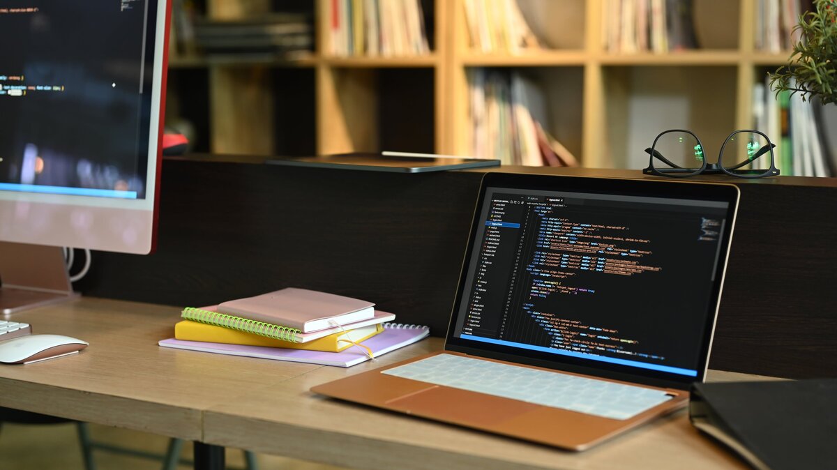 laptop-and-computer-pc-on-wooden-office-desk-with-2023-11-27-05-24-52-utc-min