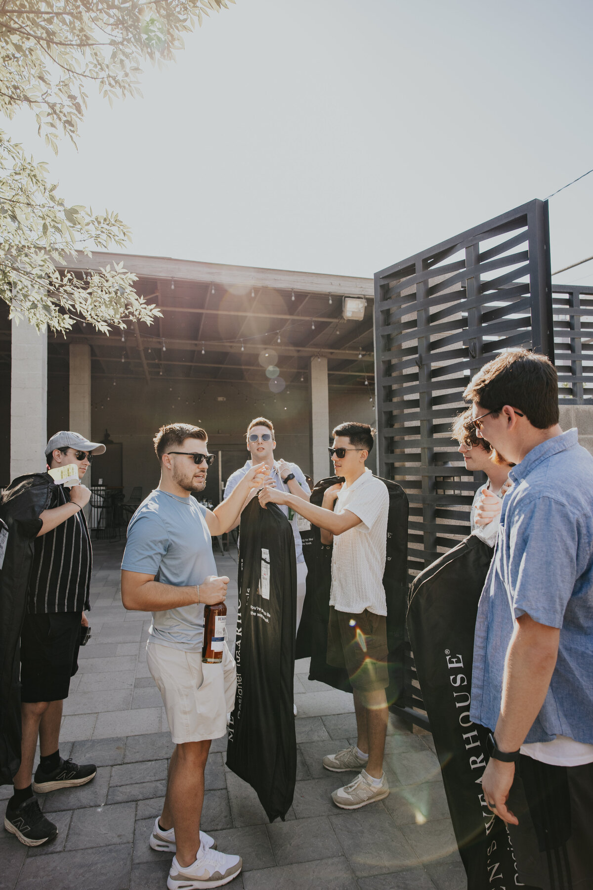 Groomsmen with groom as they are getting ready for the wedding at the croft downtown