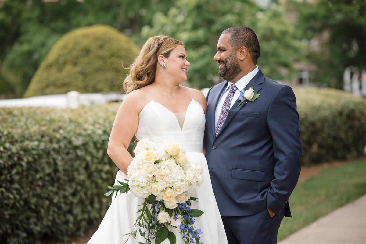 Romantic wedding portrait of bride and groom outside Le Méridien Charlotte, captured by an experienced Indian wedding photographer in Charlotte.