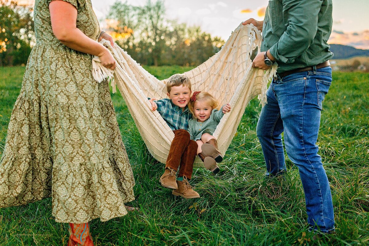 Family swinging children in a blanket in Harrisonburg VA