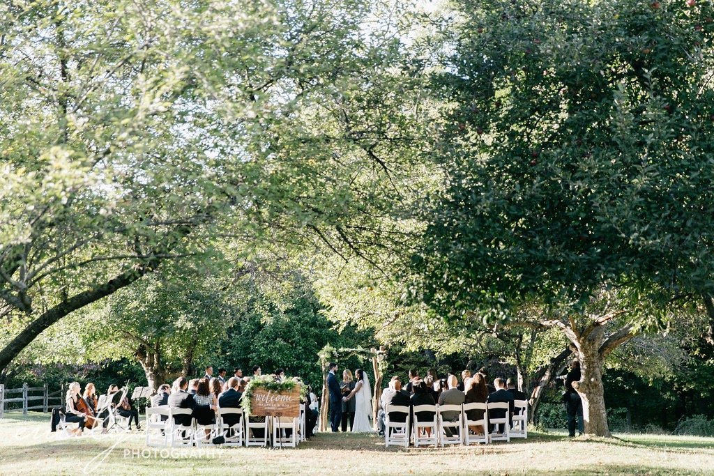 A young couple is married by wedding officiant Donna Forsythe of Lehigh Valley Celebrants at the John James Audubon Center near Philadelphia Pennsylvania.