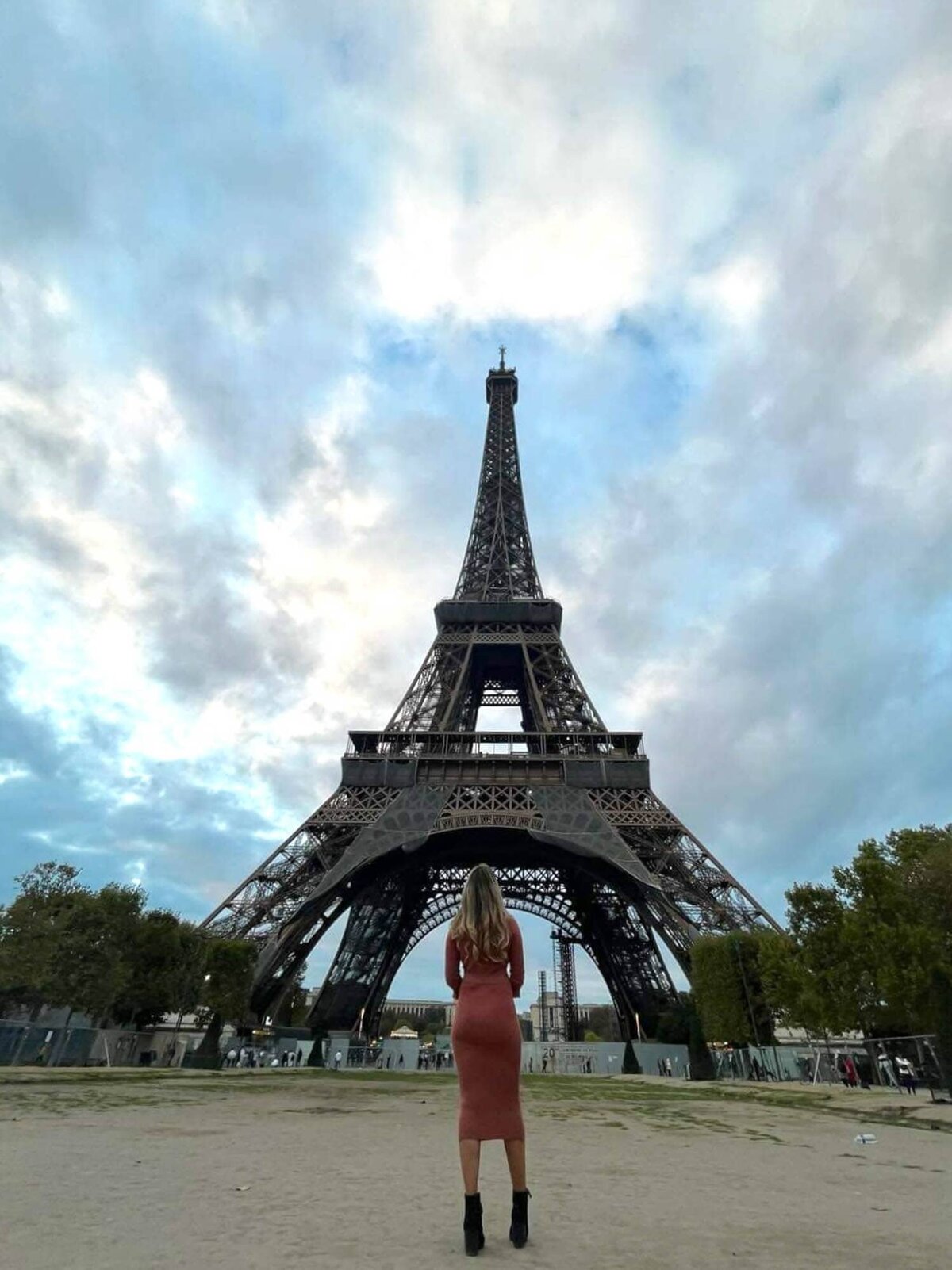 Colorado wedding and boudoir photographer standing in front of the Eiffel tower