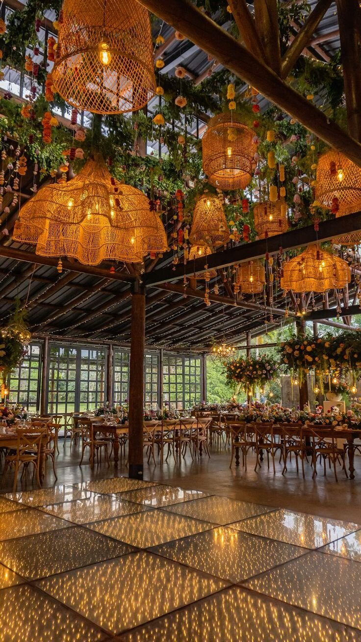 Reception space with hanging rattan lanterns and garden ambiance, design inspiration for Airlie Gardens evening events