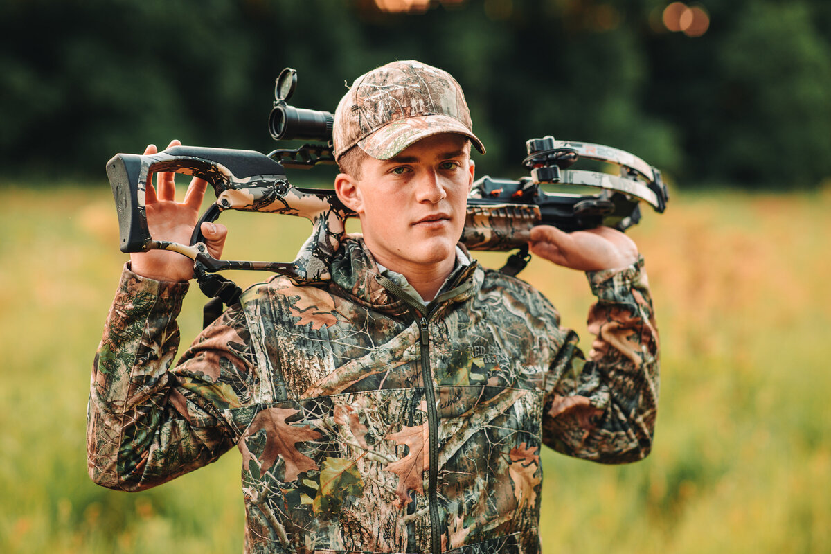 senior-guy-poses-wisconsin-rural-hunting