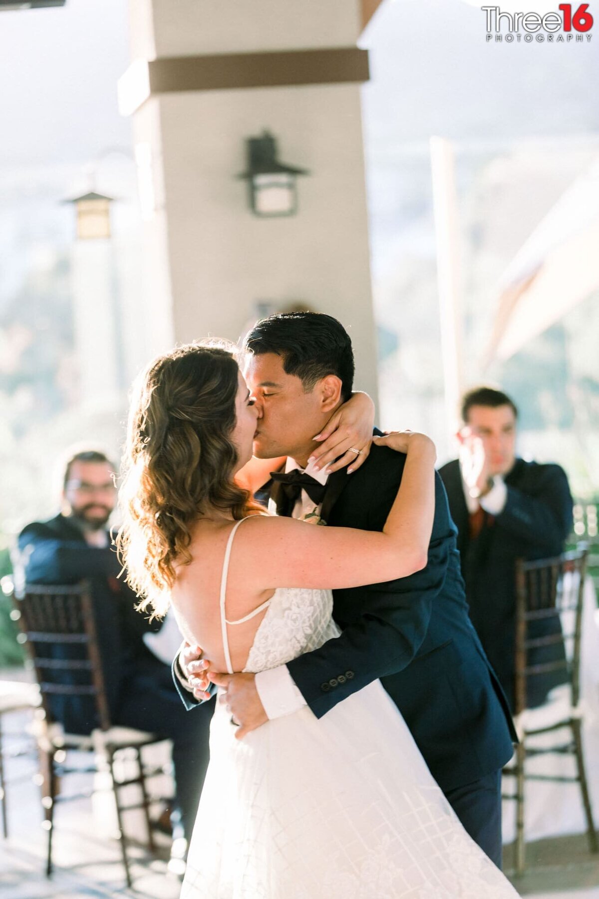 Bride and Groom share a tender kiss during their first dance