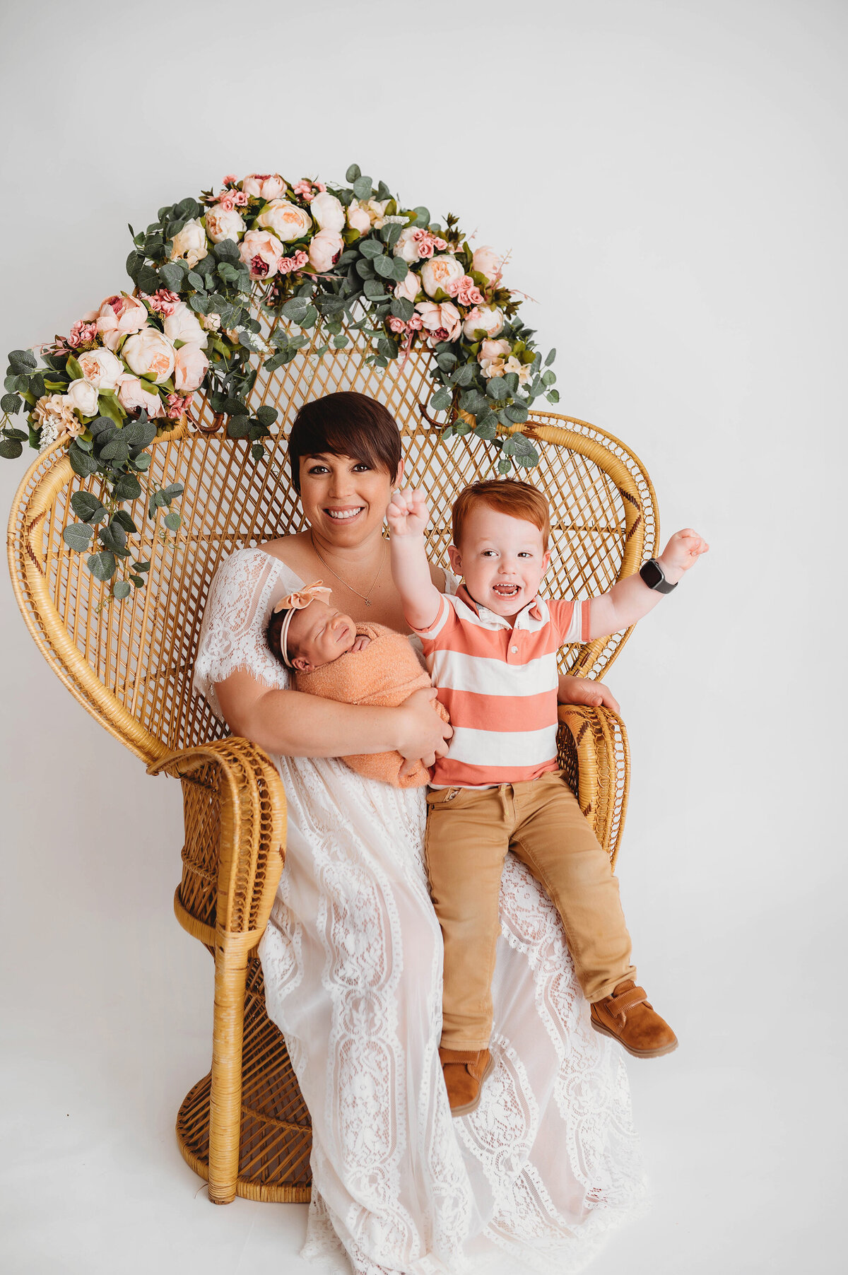 Mother poses with her children during Newborn Portrait Session in Asheville.
