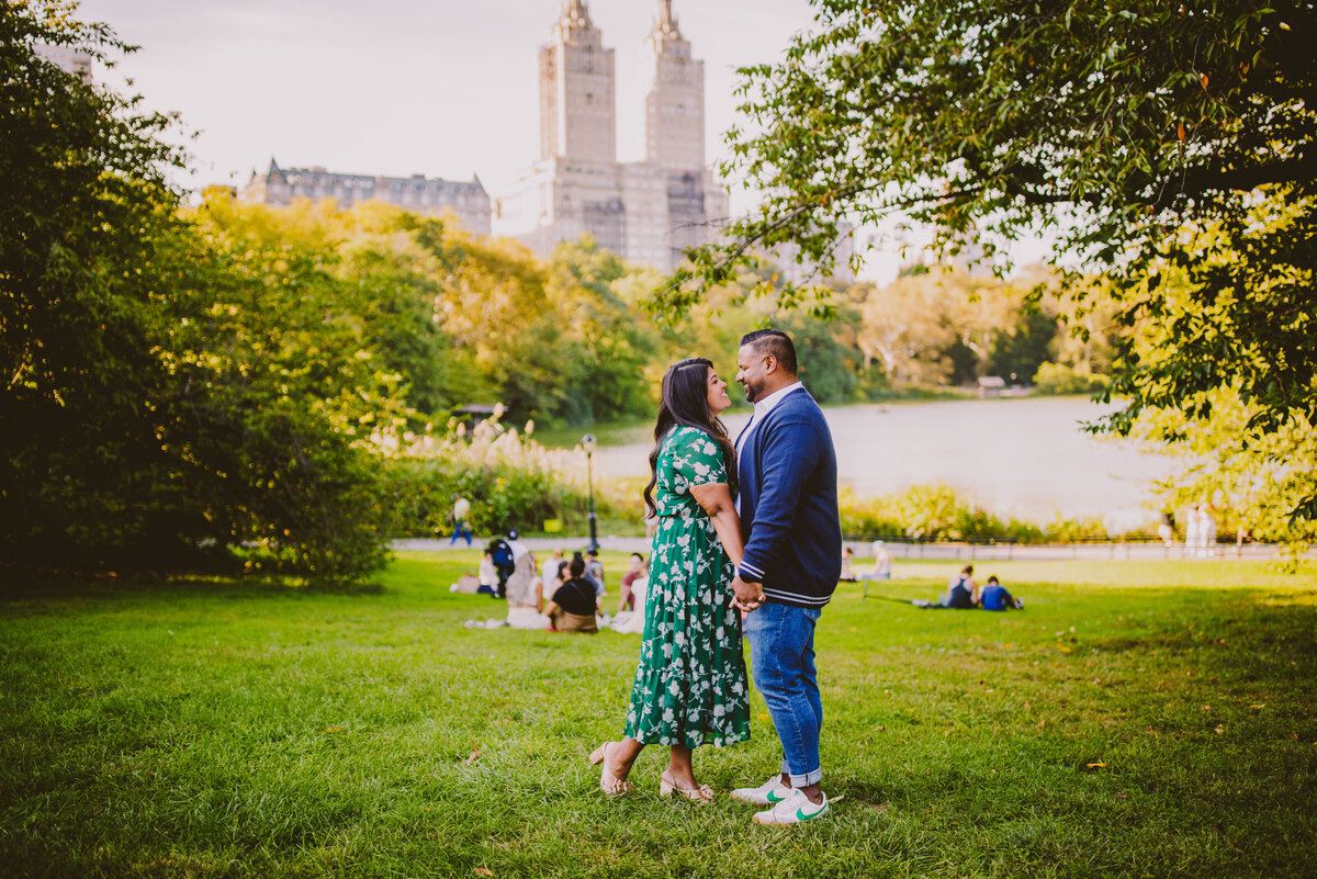 A couple embracing at the cherry hill at central park in nyc