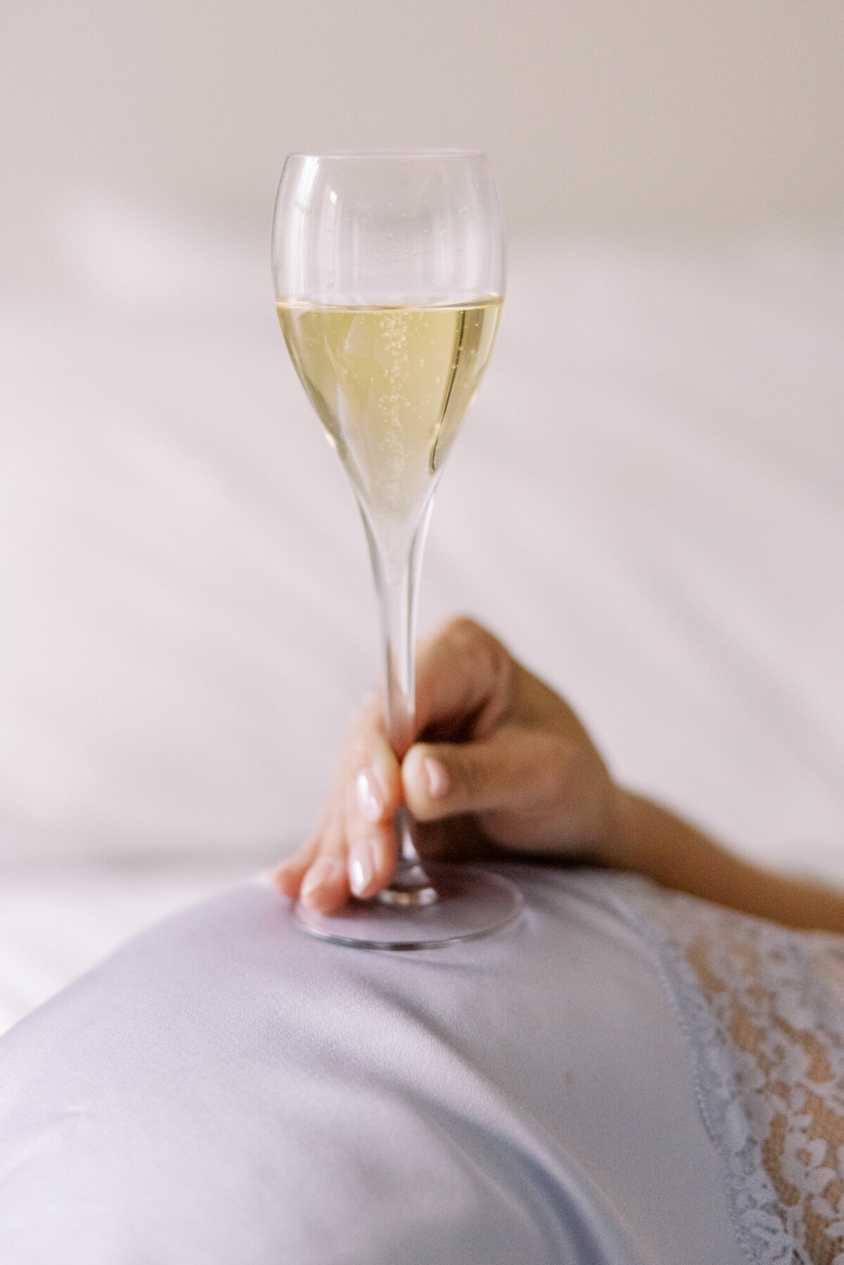 Detail photo of Bollinger champagne and lace lingerie during hotel boudoir session