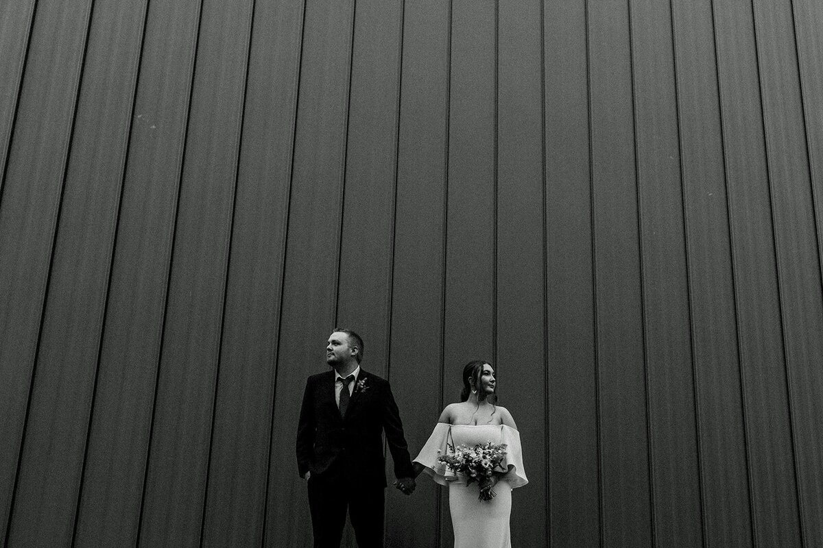 elopement couple in front of building black and white