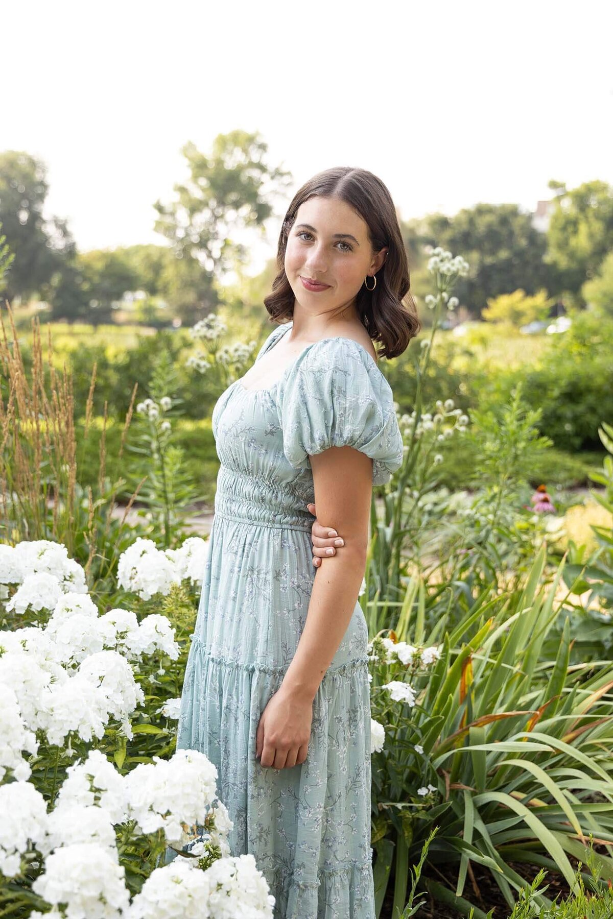 senior-girl-in-blue-dress-by-flowers