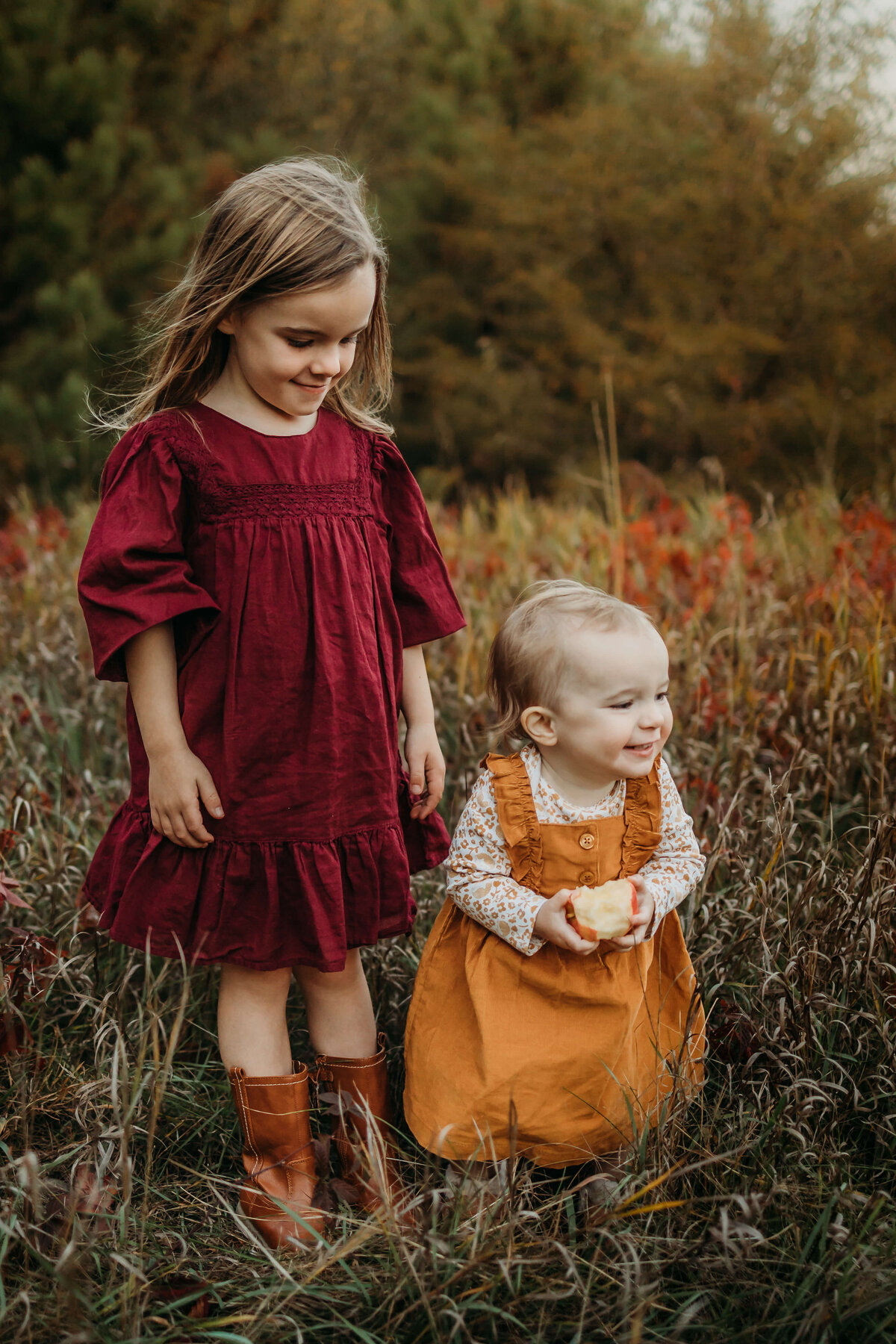 sisters in field during fall near eau claire wi