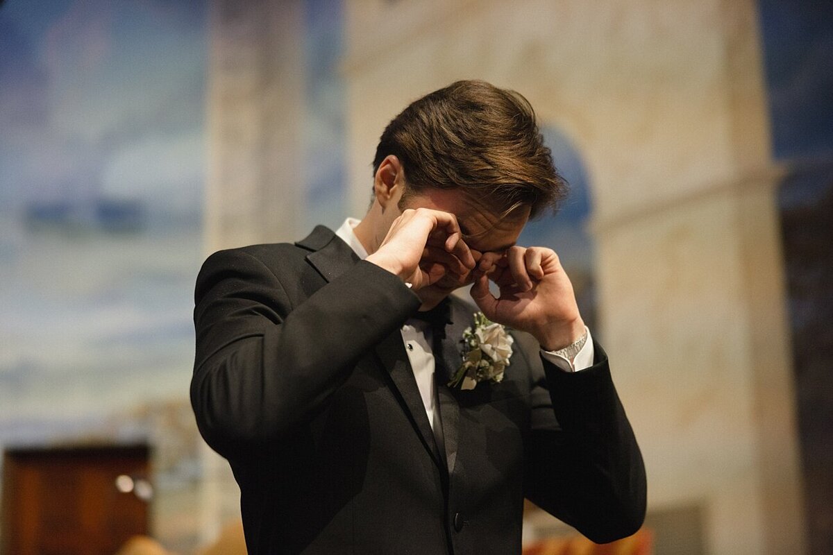 Groom crying during the wedding ceremony