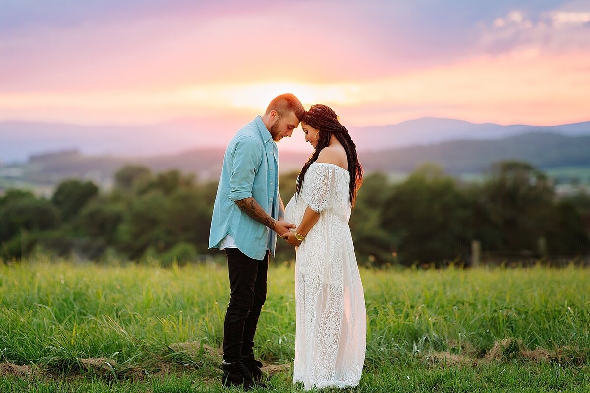 Maternity session in white dress with sunset in Harrisonburg, VA