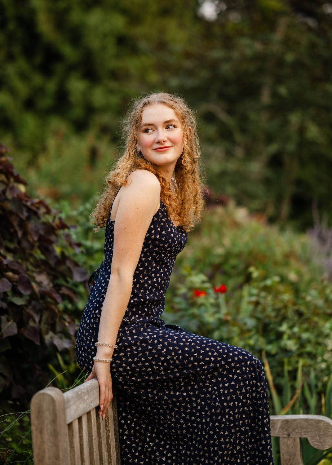 flower garden senior sitting on back of bench