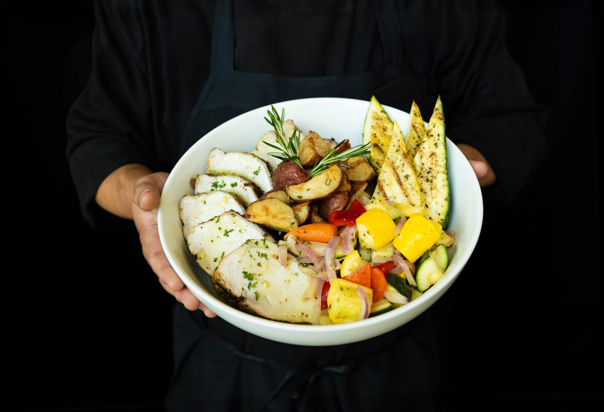 Chef-holding-menu-item-brand-photo